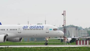 ALMATY, KAZAKHSTAN MAY 4, 2019 - Boeing 757 of Air Astana taxiing at Almaty airport, Kazakhstan. Tourism and travel concept. video