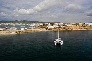 Aerial view on catamaran and port on the background. photo