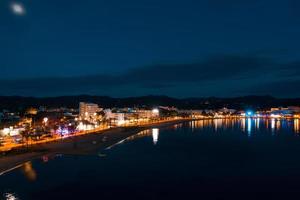 Beautiful aerial view on coast of the night city photo