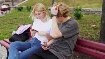 A guy with a girl in the summer in the park. photo