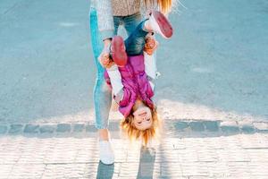 Mom and girl playing, having fun photo