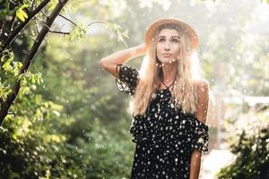 Girl in hat posing on camera photo