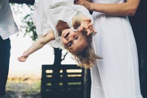 mother playing with his little daughter photo