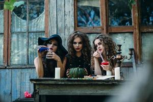 three witches at the table photo