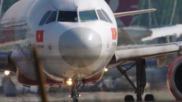 PHUKET, THAILAND NOVEMBER 13, 2019 - VietJetAir Airbus A320 VN A699 turn runway before departure at Phuket International airport. video