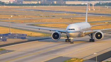 FRANKFURT AM MAIN, GERMANY JULY 19, 2017 Air China Boeing 777 taxiing after landing on runway 25R early morning. Fraport, Frankfurt, Germany video