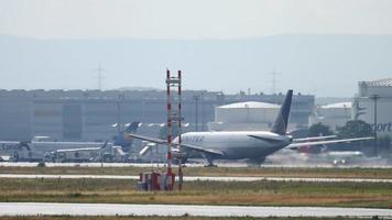 FRANKFURT AM MAIN, GERMANY JULY 20, 2017 - United airlines Boeing 777 accelerate before departure at 25C, rainy weather, slow motion. Fraport, Frankfurt, Germany video