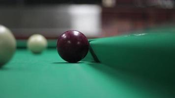 Game of billiards. White billiard balls roll on the table. Sports entertainment in the bar. Simple background with a pool table. Balls hitting and moving. video