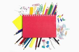 School and office supplies on white background photo