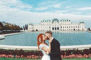 Wedding couple on a walk in the estate of the Belvedere in Vienna photo