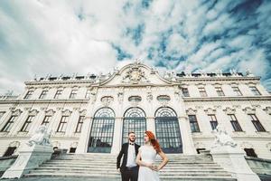 Wedding couple on a walk in the estate of the Belvedere in Vienna photo