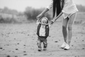 Mom with preteen child walking outdoor photo