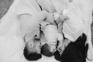 Happy family relaxing together on the mattress photo