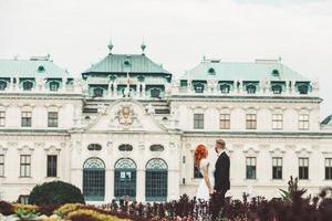 Wedding couple on a walk in the estate of the Belvedere in Vienna photo