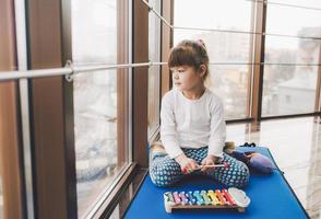 Mother and daughter playing with toys in the gym photo