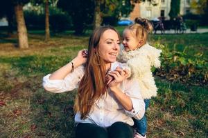 Mother and little daughter in a park photo