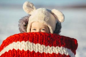 Little girl child sitting on sledges photo