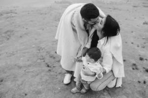 Young family together in nature with a little boy photo