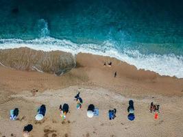 Beach with sun loungers on the coast of the ocean photo