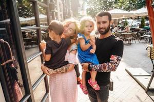 beautiful young family with ice cream photo