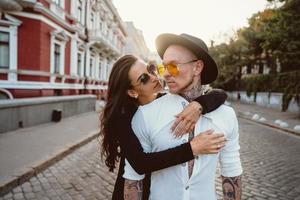 Girl hugging her boyfriend on the street photo