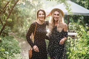 Two girls in a summer park photo