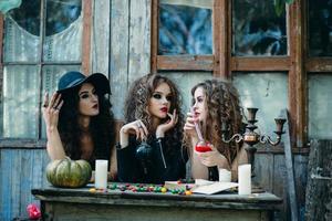 three witches at the table photo