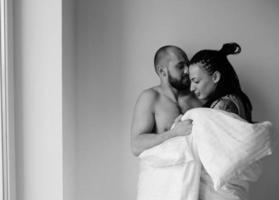 man and woman in the bedroom photo