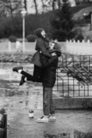 beautiful couple having fun on the pier photo