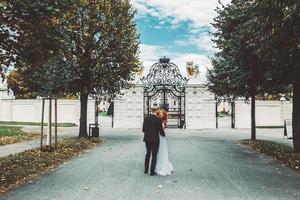 Wedding couple on a walk in the estate of the Belvedere in Vienna photo