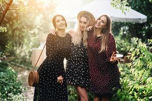 Three girls are photographed on camera photo