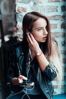 Beautiful girl listening music photo