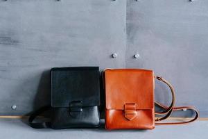 two leather bags on a gray background photo