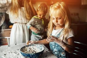 Kids is playing with flour photo