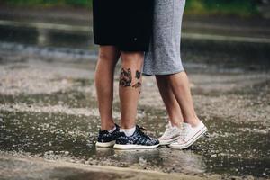 couple on the background of wet asphalt photo