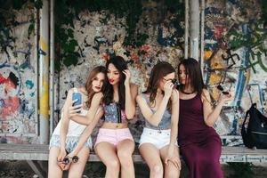 Five beautiful young girls relaxing photo