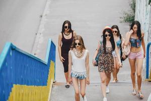 Five young beautiful girls in the city photo