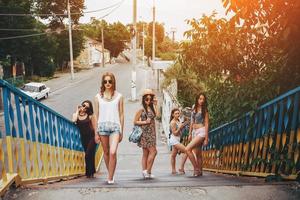 Five young beautiful girls in the city photo