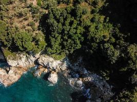 Drone top view of a sea cliff and a beach photo
