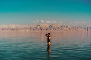 Young woman going to Dead Sea, Israel photo