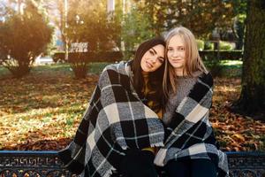 two beautiful in the park, posing for the camera photo