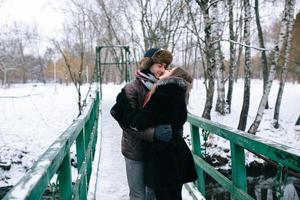 beautiful couple on a bridge photo