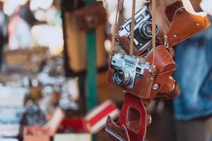Old cameras are sold at a street market photo