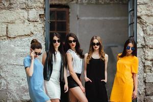 Five young beautiful girls in the city photo