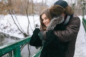 beautiful couple on a bridge photo