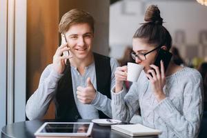 Guy and girl at a meeting in a cafe photo