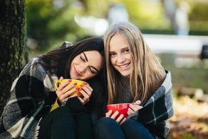 two beautiful in the park, posing for the camera photo