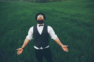 man with a beard, thinking in the field photo