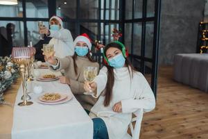 Multi-ethnic young people celebrating New year eve at party photo