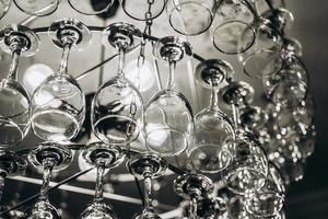 Beautiful chandelier made with glasses of wine photo